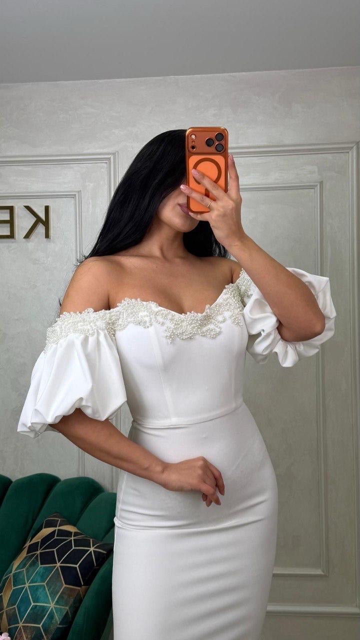 White Rochie Bombess by iqfashioncluj, showcasing a stylish, elegant dress with a flowing design and detailed fabric texture.