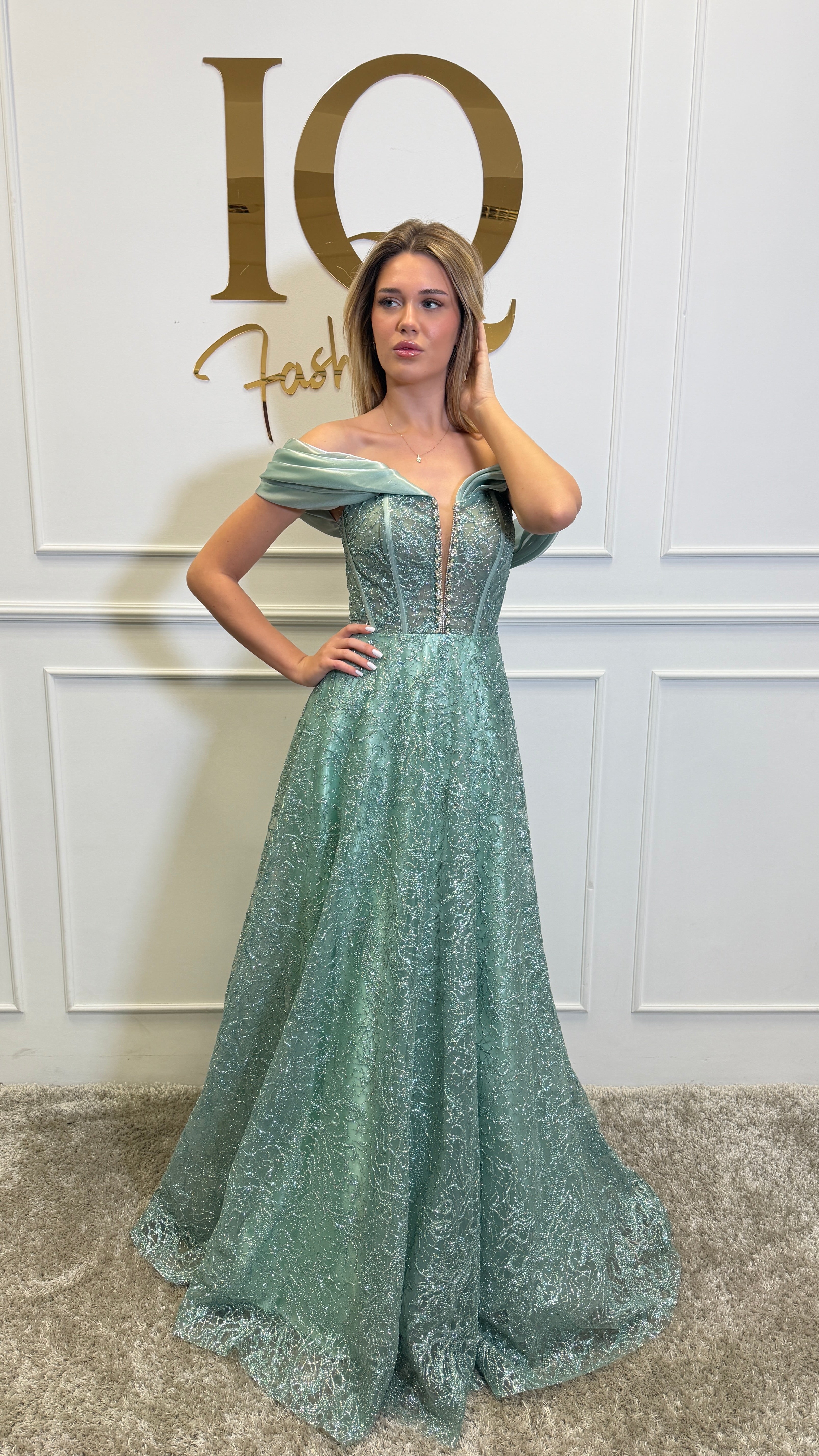 Elegant Diamond Minth dress by iqfashioncluj featuring a stylish, form-fitting design with intricate details and vibrant color.