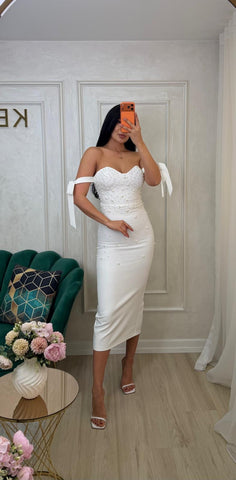 White Rochie Bombo from iqfashioncluj, stylish feminine dress with elegant design, displayed on a hanger.