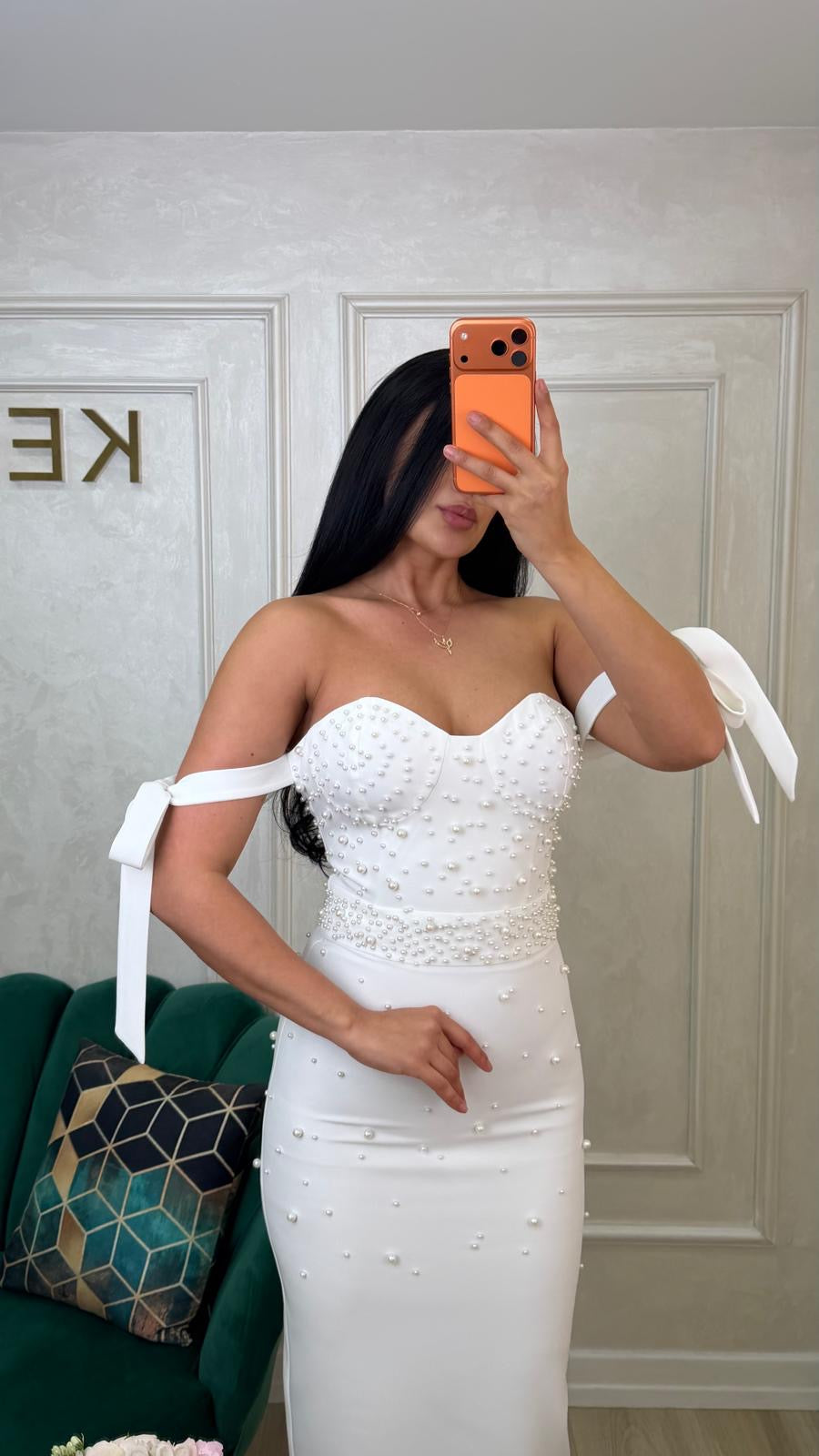 Elegant white Rochie Bombo by iqfashioncluj displayed on a hanger with detailed fabric and stylish design.