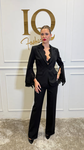 Elegant black lace costume by ELVE STYLE SRL with intricate lace details and figure-flattering design.