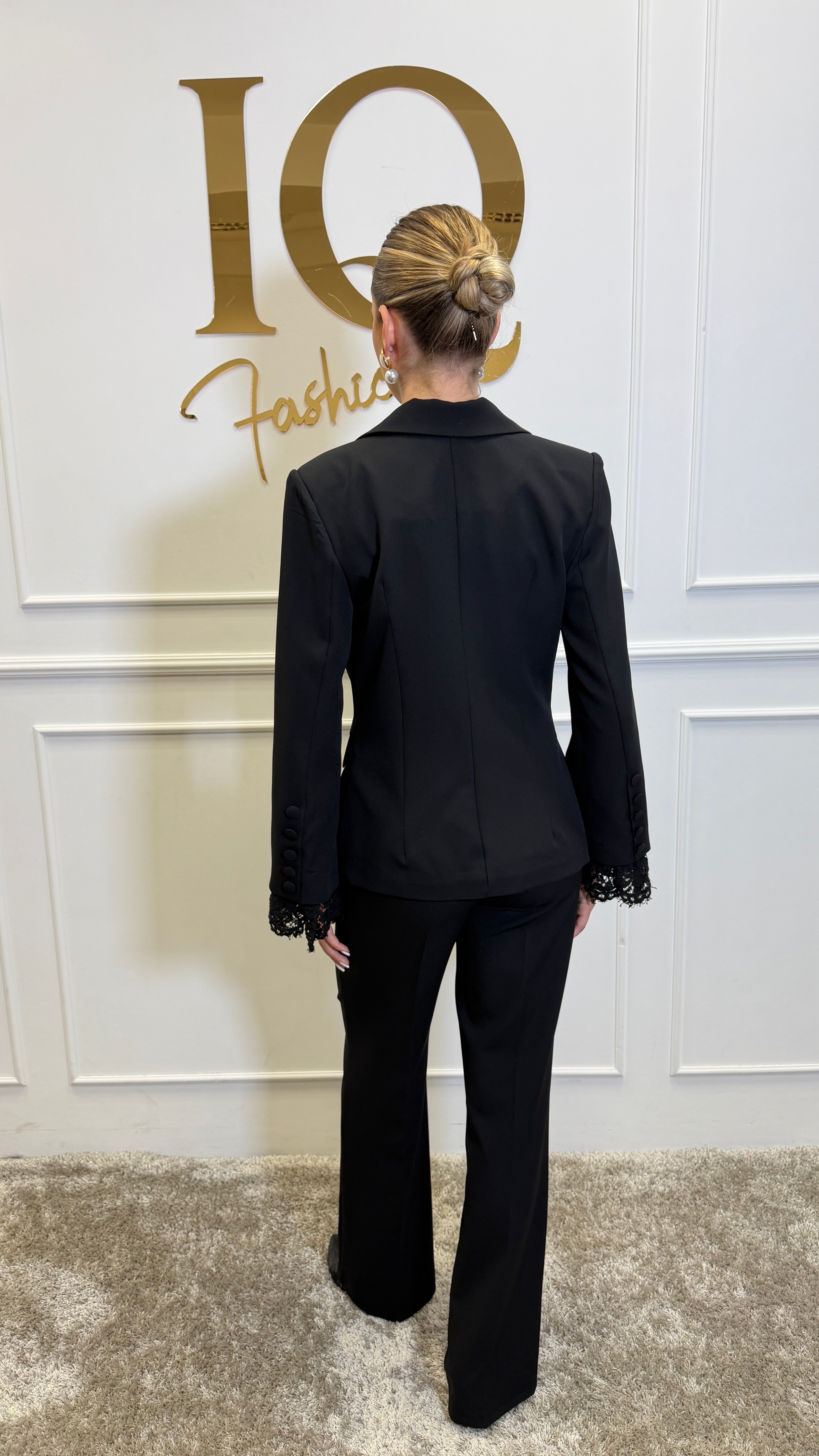 Elegant black lace costume by ELVE STYLE SRL featuring intricate lace details and a flattering fit.