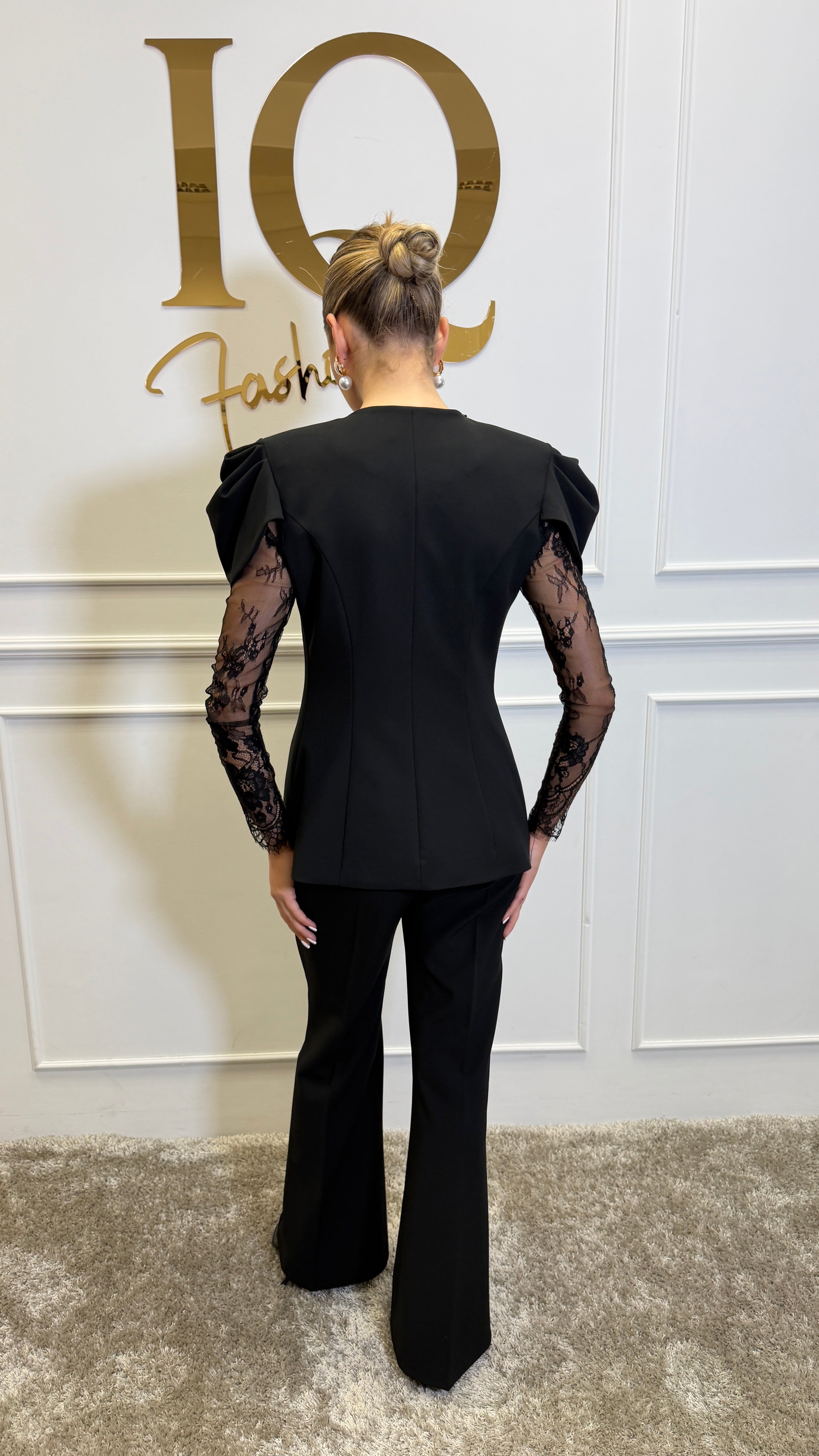 Black Leona costume by ELVE STYLE SRL, featuring a stylish design with intricate details and a flattering fit.