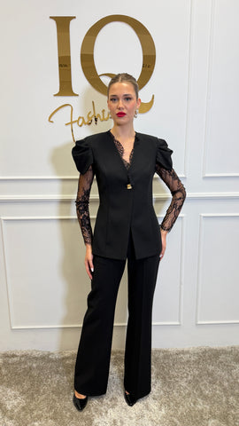 Black Leona costume by ELVE STYLE SRL, featuring a sleek design with intricate details and a fitted silhouette.